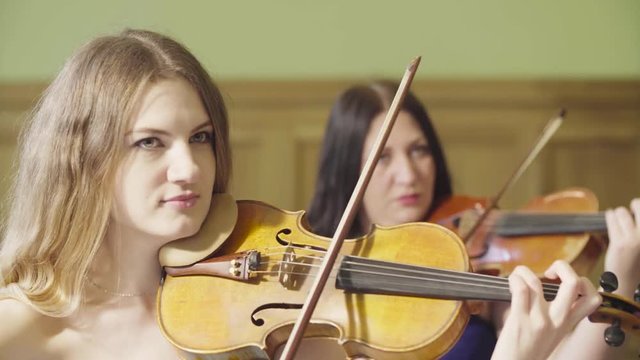 Portrait of two women playing music