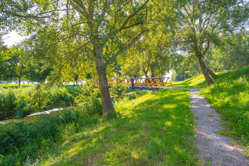 Fototapeta na wymiar Canal in a rural landscape in summer