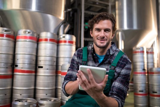 Portrait of worker using tablet computer in warehouse