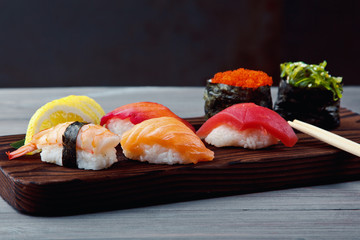 Fresh Sushi set with salmon, prawns and tuna. Traditional Japanese cuisine.