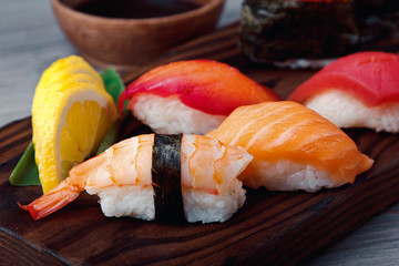 Fresh Sushi set with salmon, prawns and tuna. Traditional Japanese cuisine.