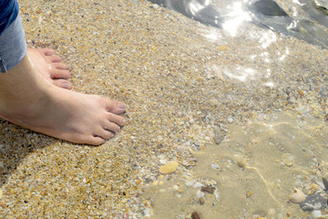 Bare foot on sand