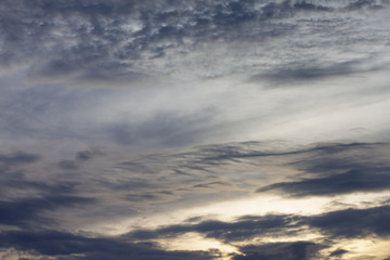 Gold sky conditions with black clouds on evening time.