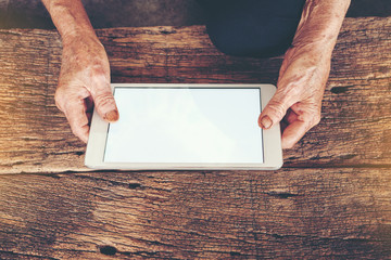 Close up of a old man using mobile smart phone,  senior woman using Cell phone or holding finger on...