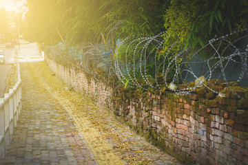 Abstract background of army camp fence with lens flare,  Every cloud has a silver lining, even there are too many wars in this world but world is still lovely home for us