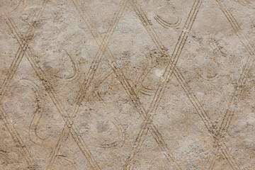 A background consisting of geometric shapes. A wall of brown rhombuses