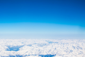 Snow Alps - aerial view from window of airplane