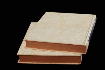 books stacked on black background.