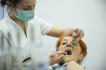 Senior Woman Sitting In A Dentists Chair