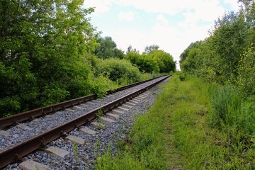 Obraz premium Rusty track rails. The railway track itself is new, the rails rust from time because there are no trains running through them.
