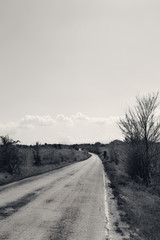 Landscape with empty road, black and white