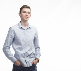 Young sexy man portrait of a confident businessman showing presentation on a gray background. Ideal for banners, registration forms, presentation, landings, presenting concept.