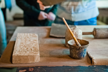 Pottery production. How to make clay products, jugs, pots, vases. Clay workshop. Painting and modeling of clay products