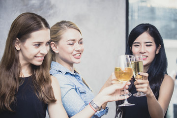 Group of woman holding wine glass with happy emotion, people with party concept.