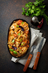 Chakhokhbili - traditional Georgian dish. Stewed chicken with tomato, onion, garlic, pepper and cilantro. Selective focus. Top view.