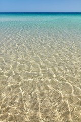 Fototapeta na wymiar Shallow water with sun reflections, natural background or wallpaper.