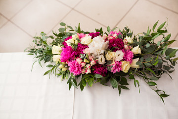 Wedding peony bouquet on table