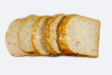 slices of whole wheat bread isolated on white background.
