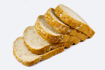 slices of whole wheat bread isolated on white background.