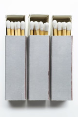 Close up of three matchboxes, isolated on white