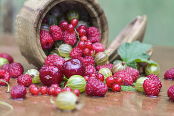 Dessert. Fresh juicy berries in a wooden cup.