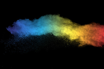 Fototapeta na wymiar Launched colorful powder, isolated on black background