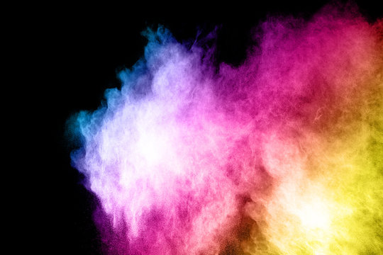 Launched colorful powder, isolated on black background