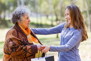 Happy elderly woman with her daughter