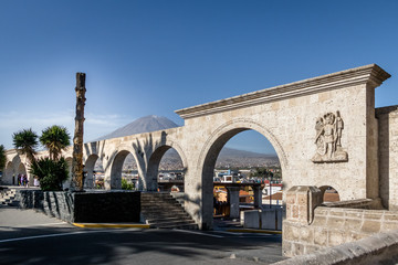 The Arches of Yanahuara Plaza and Misti Volcano on Background - written on the arches are quotes of famous people of the city - Arequipa, Peru - obrazy, fototapety, plakaty