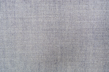Darker and lighter grey fabric fibres close up
