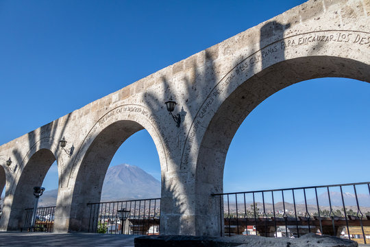 The Arches of Yanahuara Plaza and Misti Volcano on Background - written on the arches are quotes of famous people of the city - Arequipa, Peru © diegograndi