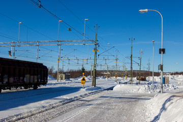 railway path in snow winter clear sky day
