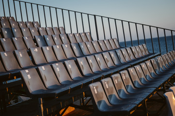 Fototapeta premium Empty seats row ready for visitors abstract event pattern background