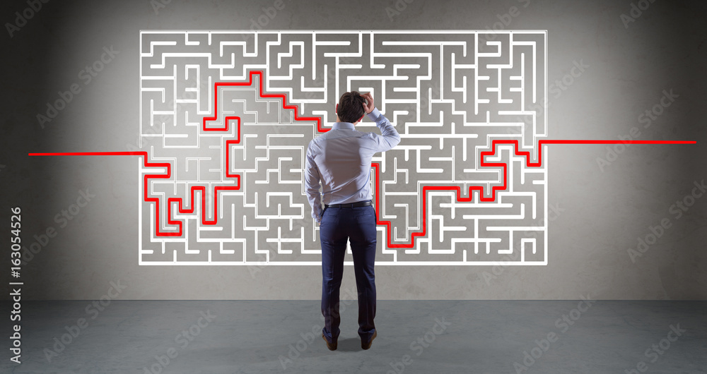 Aufkleber Businessman searching maze solution on a wall 3D rendering
