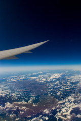 airplane wing above earth