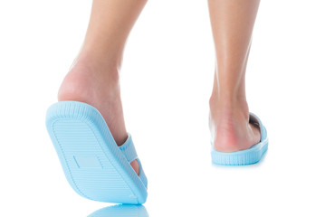 Woman feet wearing beautiful blue sandal step with back side on white background, Fashion woman...