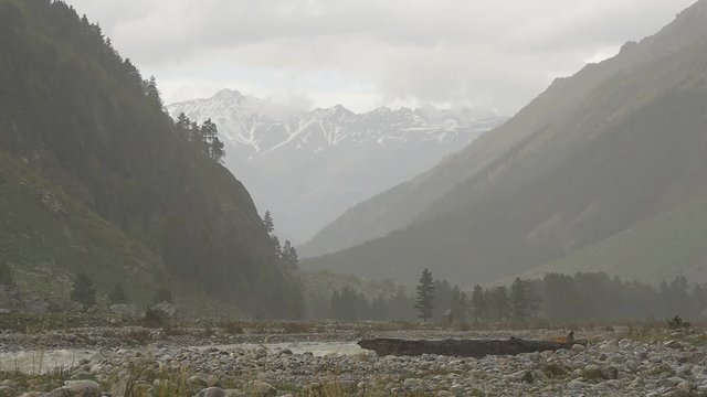 Storm with rain and snow in mountains