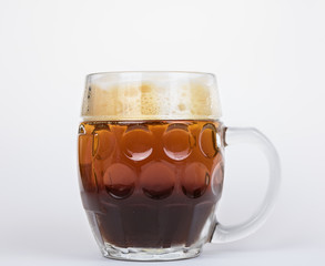 Dark and light beer in mug.