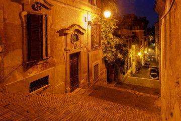 Rome. Old street with a staircase at night.