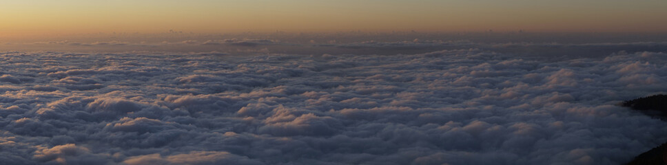 Fototapeta na wymiar Clouds over the ocean during sunset