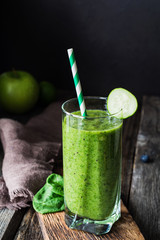 Green smoothie, healthy detox cold drink, vegan. Closeup view