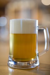 Close-up of beer mug on table