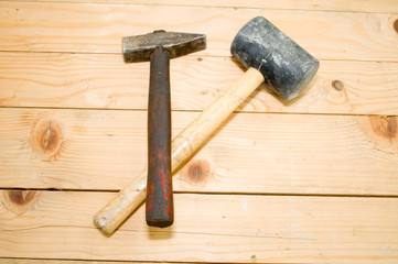 2 hammers, one is of iron and the other is rubber