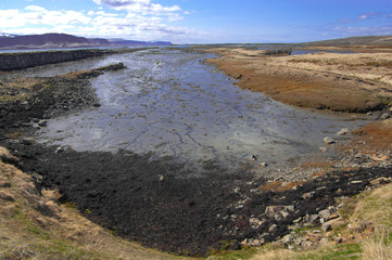 Fjord at Low Tide:  The shallow bottom at the end of an Icelandic fjord is visible between tides.