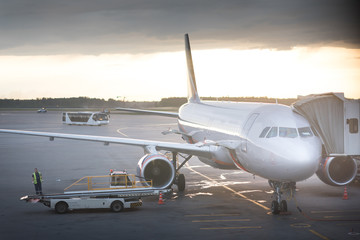 Airplane is taxiing to take off at the sunrise