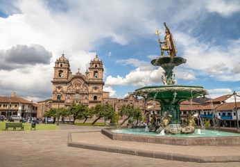 Plaza de Armas with Inca Fountain and Compania de Jesus Church - Cusco, Peru
