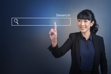 Beautiful Business Woman touching web search bottom sign on virtual screen