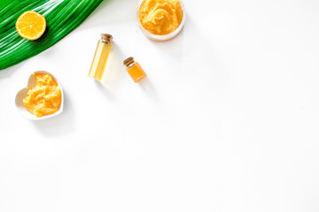 Organic cosmetic with citrus. Cream, scrub and lotion on white background top view copyspace