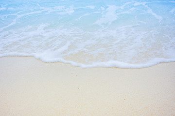 Fototapeta na wymiar wave blue sea water on the beach