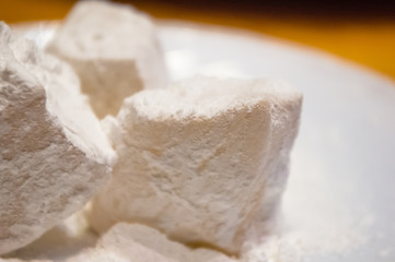 Turkish delight or rahat-lokum on a white saucer